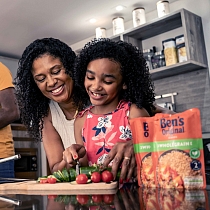 Family in kitchen cooking
