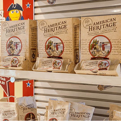 Packages of American Heritage Chocolate on shelving